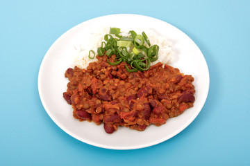 Indian legume hash with rice on a blue