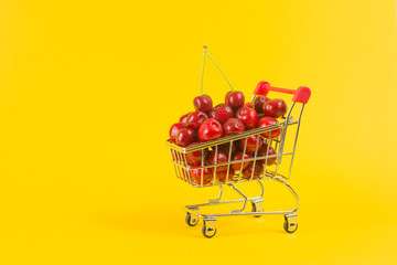 juicy cherry in a shopping cart, harvest of fresh berries