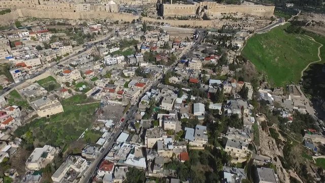 Aerial view fly over Jerusalem alleys and villages, towards Temple mount mosque, Western wall.