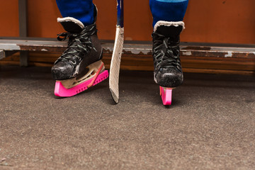 young hockey player sitting on a bench