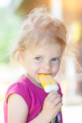 little girl enjoying an ice