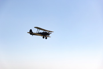 Fototapeta na wymiar Day of the Air Fleet. Biplane in the sky, in the air