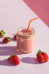 Sweet smoothies from strawberries on white background