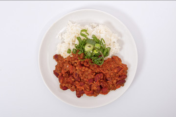 Indian legume hash with rice on a white