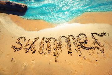 the word summer in the sand