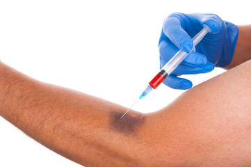 Man having injection in arm on white background