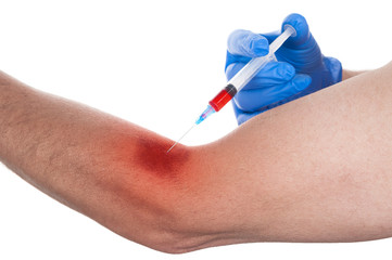 Man getting an injection with syringe on white background