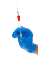 Doctor`s hand in blue glove with syringe on white background