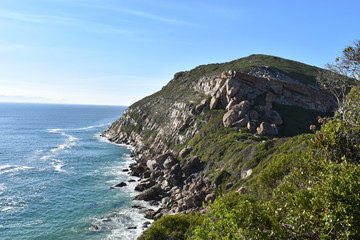 Fototapeta na wymiar Wonderful landscape with the blue beach at the hiking trail at Robberg Nature Reserve in Plettenberg Bay, South Africa