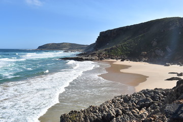 Wonderful landscape with the blue beach at the hiking trail at Robberg Nature Reserve in Plettenberg Bay, South Africa