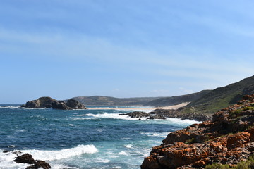 Wonderful landscape with the blue beach at the hiking trail at Robberg Nature Reserve in Plettenberg Bay, South Africa