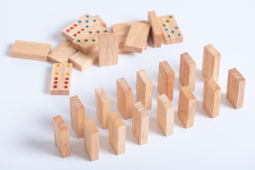 wood domino pieces on white background