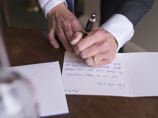 Man writing card