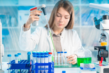 Chemical laboratory scientist woman working with pipette