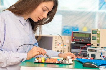 girl student in the class physics and electronics