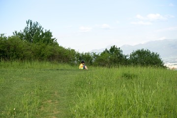 Woman sitting in the grass. Slovakia