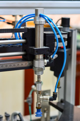 pneumatic piston on the machine, close up