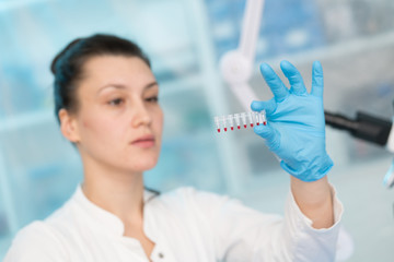 Young woman with genetic research in the laboratory research of cancer diseases