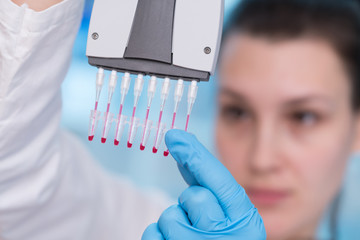 Young woman with genetic research in the laboratory research of cancer diseases