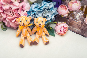 Beautiful toy bears on stylish floral background, shabby chic idea with Teddy bears