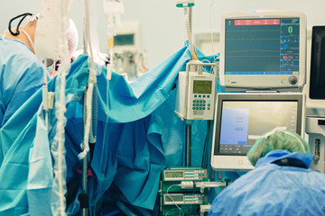 Total Artificial Heart connected in surgery to TAH pump that is surgically installed to provide circulation and replace heart ventricles. Machine outside body control blood flow to and from the heart.