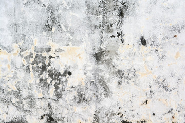 Old white wall with sloppy black streaks.