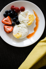 poached eggs and fruit breakfast