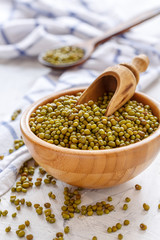 Organic mung beans in wooden bowl.