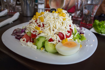 Traditional Bulgarian salad Shopska with vegetables and cheese