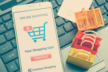 Online shopping / retail ecommerce and delivery service concept : Moblie with shopping app, a...