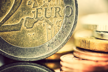 Europe fiat money or euro currency concept : Closeup view of used two euro coin with grooves and...