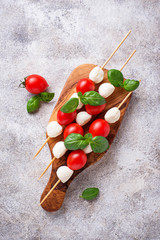 Caprese skewers with mozzarella, tomatoes and basil