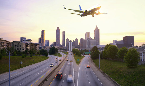 Airplane flying over Atlanta skyline, Georgia USA
