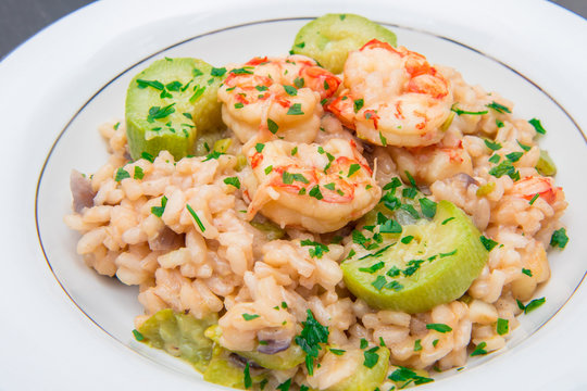 dish with risotto with prawns and zucchini