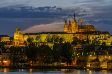Fototapeta na wymiar Panoramic View on Old Town , Prague Castle Saint Vitus Cathedra. The bridge over the Vltava River. Night scene. Prague, Czech Republic . European travel.