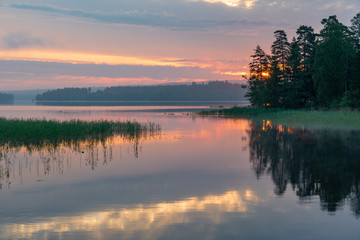 Sunrise over a calm lake in Filipstad Sweden
