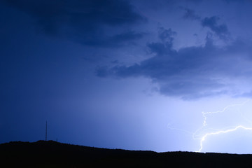 Naklejka na ściany i meble Thunderstorm in blue dark sky