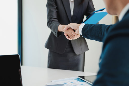 Job applicant having interview. Handshake while job interviewing.