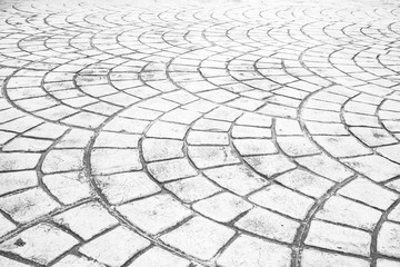 Close up perspective of stone pavement. Stone pavement texture. Granite cobble stone pavement background. Abstract background of a cobblestone pavement