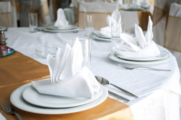 Napkins in the shape of a ship for decoration at a wedding