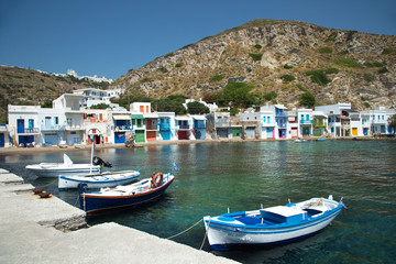 Fototapeta na wymiar Fishing boats in front of Firopotamos in Milos island