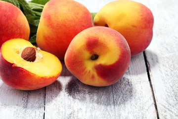 A group of ripe peaches on table