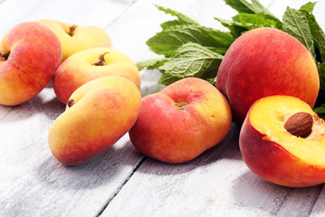 A group of ripe peaches on table
