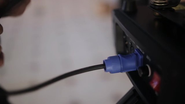 Man the installer connects to the instrument light power cable
