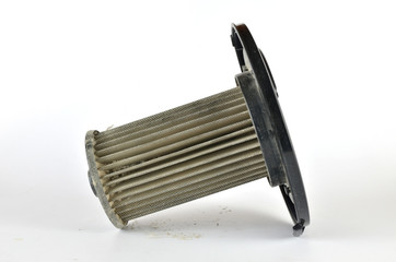 Used dirty filter of a vacuum cleaner - on a white background