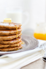 Fototapeta na wymiar Pancakes with milk and honey for breakfast