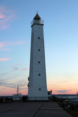 lighthouse on the waterfront of Krondshtat at sunset