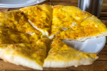Traditional Georgian bread - khachapuri on the table