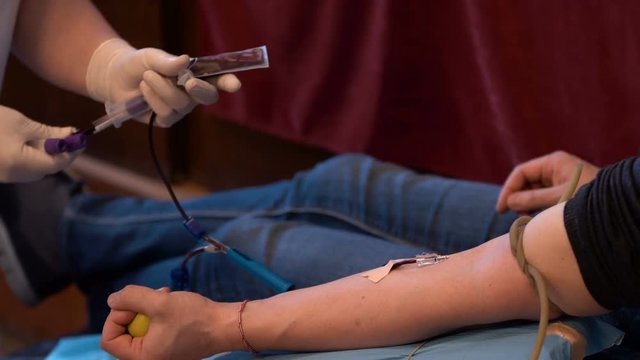 Blood donation hand. Nurse hands
