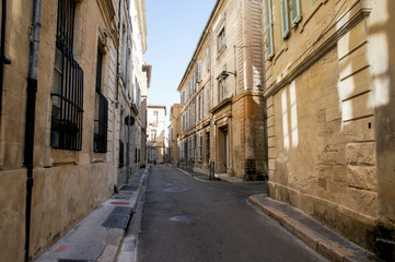 A street with narrow sidewalks.
